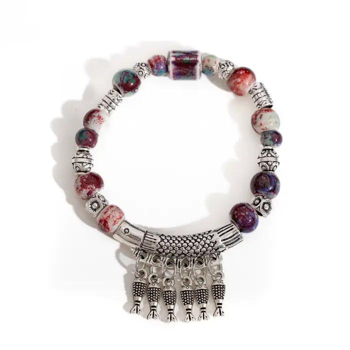 Bracelet élastique fait à la main avec perles en céramique et pendentif poisson en alliage, bijoux d