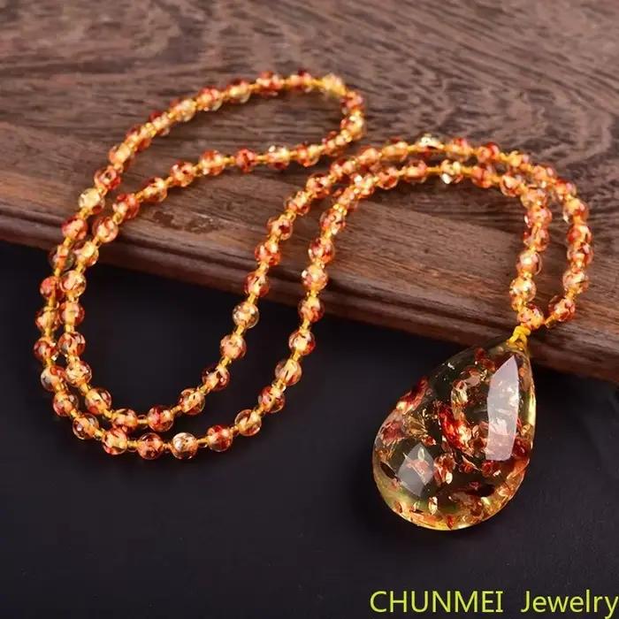 Pendentif goutte de fleur fragmentée pour homme et femme, collier arc-en-ciel original, pierre d'ambre de cire d'abeille, pull