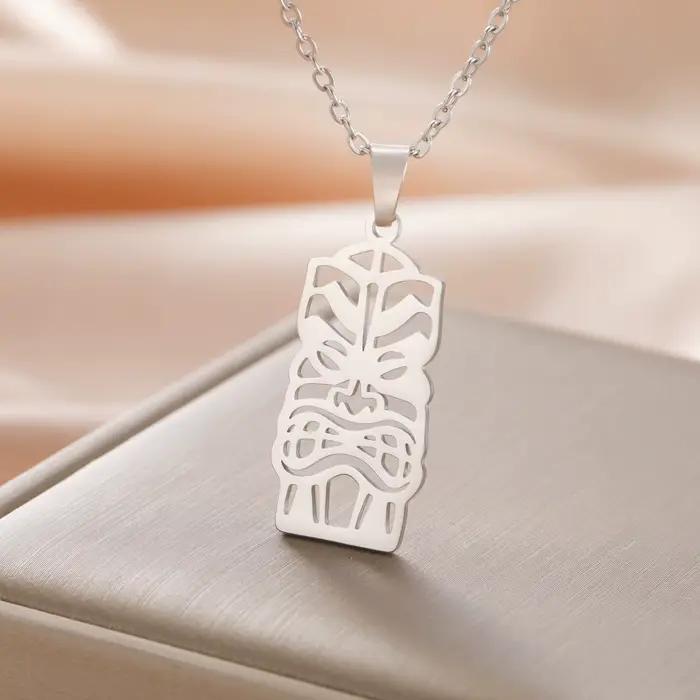 Unift Collier Tiki Hawaïen en Acier Inoxydable pour Femme et Homme, Bijou Ethnique Classique, Amulette de Protection de Dieu