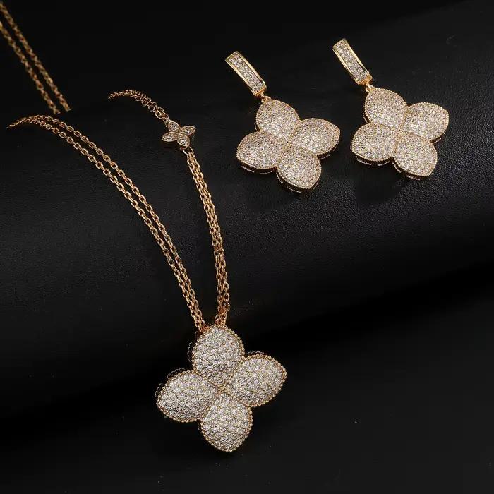 Ensemble de bijoux élégant collier et boucles d'oreilles trèfle sertis de zircone cubique plaqués or 18 carats pour femmes occasions spéciales soirée mariage