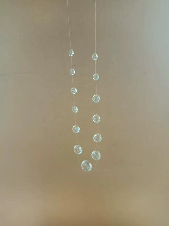Collier série pompon en forme de goutte de rosée transparente