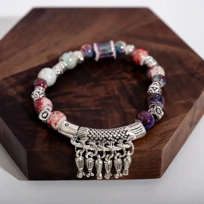 Bracelet élastique fait à la main avec perles en céramique et pendentif poisson en alliage, bijoux de Style ethnique S03-178