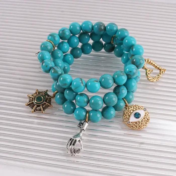 Bracelet bohème turquoise multi-breloques avec breloque œil porte-bonheur