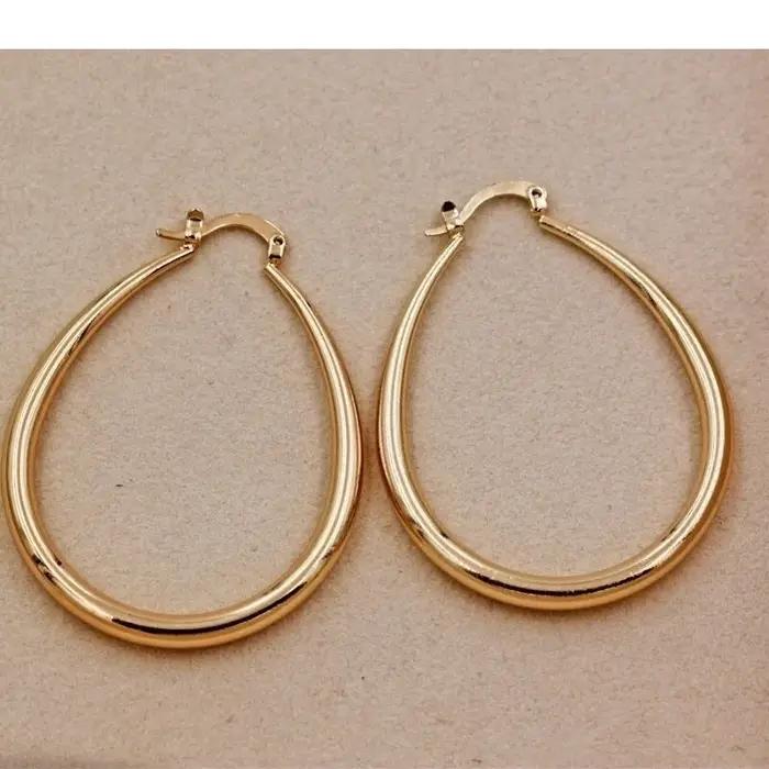 Boucles d'oreilles créoles lisses en or brillant pour femmes