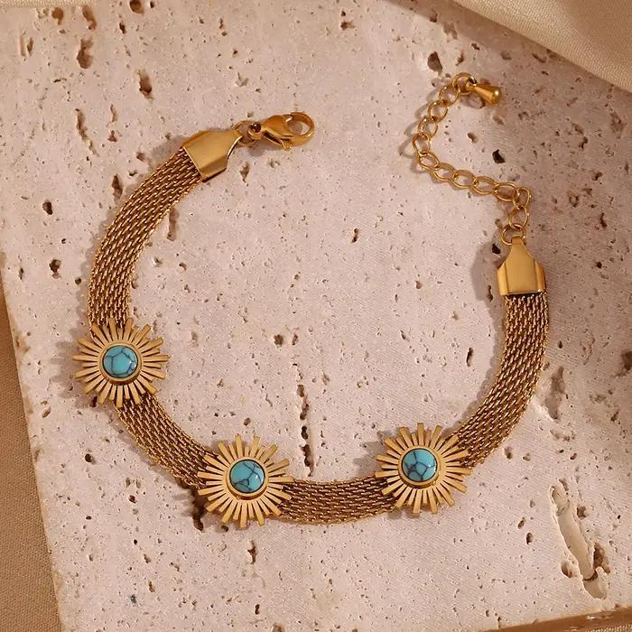 Bracelet en maille tissée bleu turquoise avec motif tournesol pour femmes occasions estivales et élégantes
