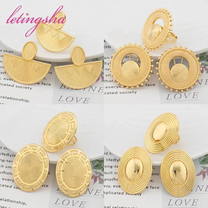 Ensemble de boucles d'oreilles et de matiques en or africain pour femmes