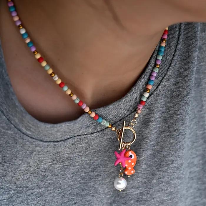 Collier bohème avec pendentif poisson et étoile de mer en céramique d'inspiration marine avec perles turquoise