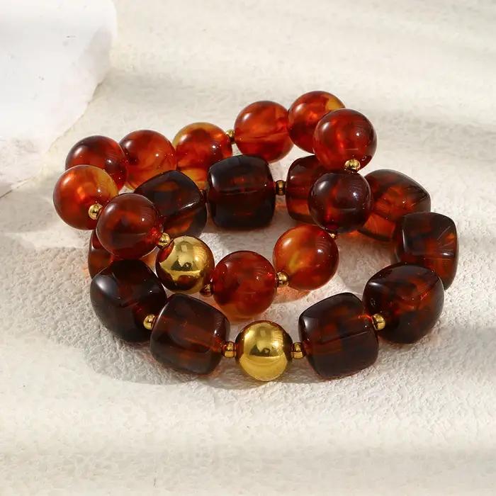 La. Bracelet de perles acryliques ambre série Muses Melad