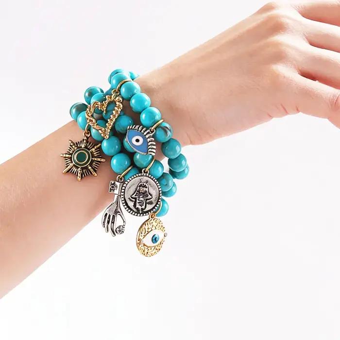 Bracelet bohème turquoise multi-breloques avec breloque œil porte-bonheur