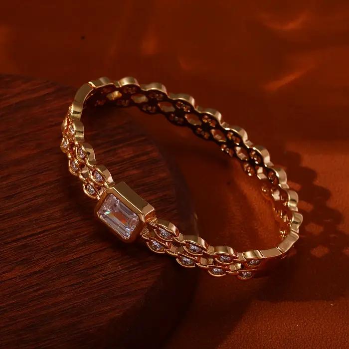 Bracelet de luxe en cristal baguette plaqué or 18 carats avec maillons de chaîne et zircone cubique