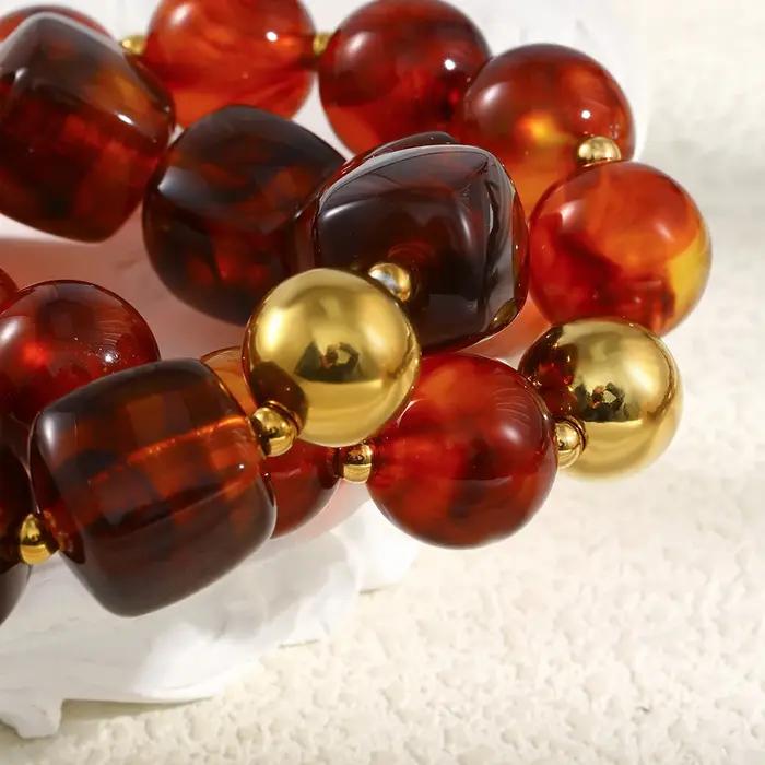 La. Bracelet de perles acryliques ambre série Muses Melad