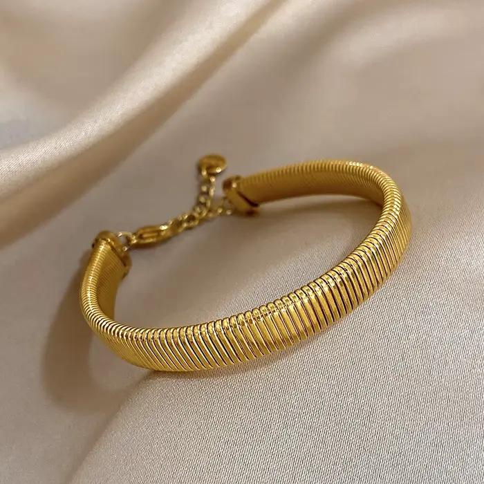 Bracelet de manchette en acier inoxydable plaqué or jaune clair avec zircon et strass