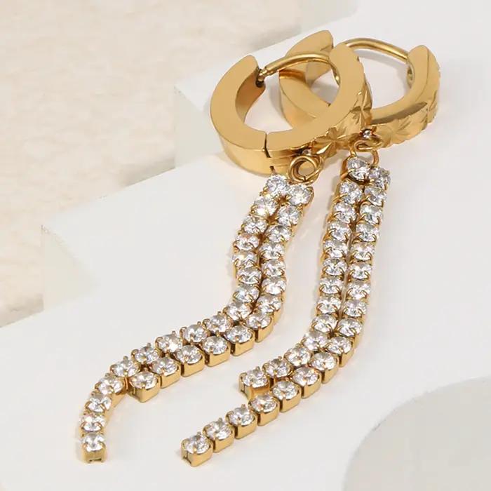E.B.belle Boucles d'oreilles créoles à fermoir avec longues pampilles en zircon et petite fleur