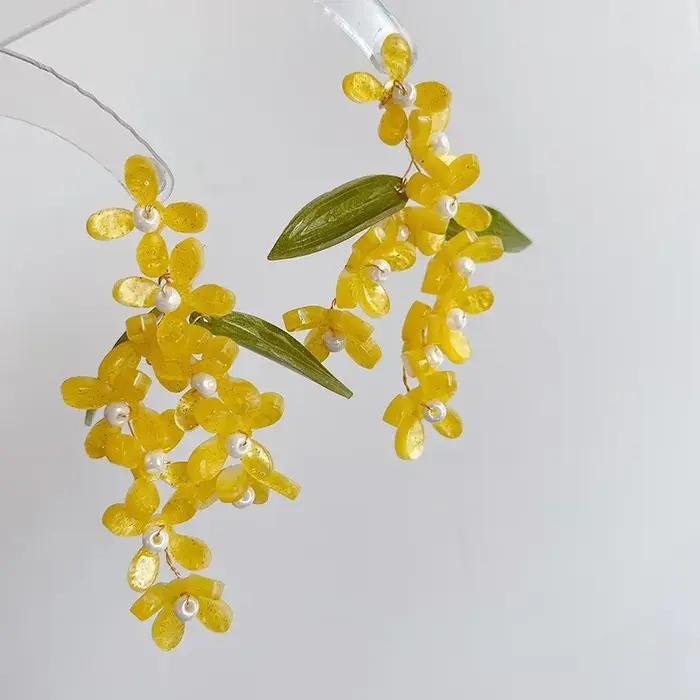 Boucles d'oreilles longues élégantes en forme de fleur