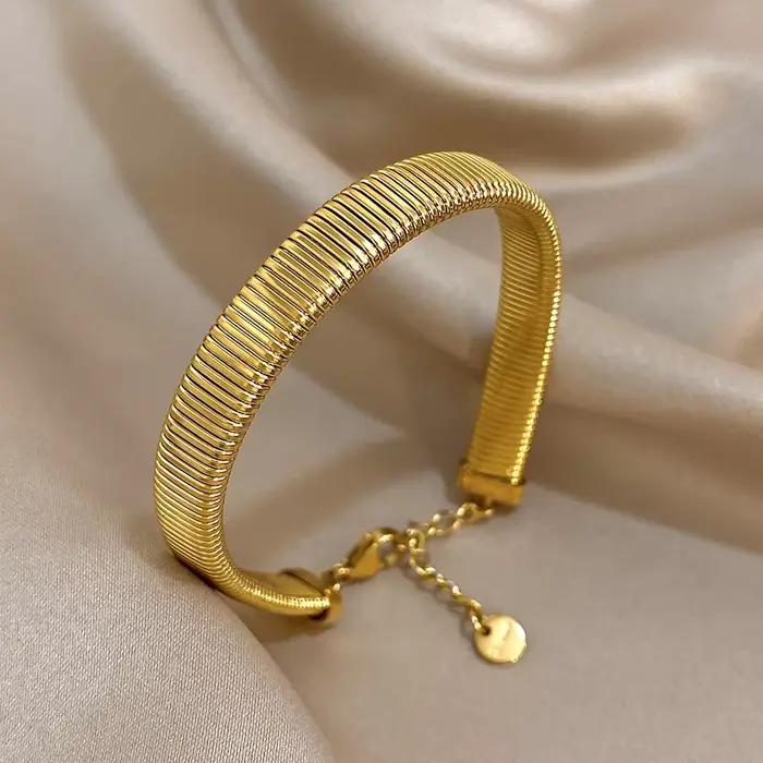 Bracelet de manchette en acier inoxydable plaqué or jaune clair avec zircon et strass