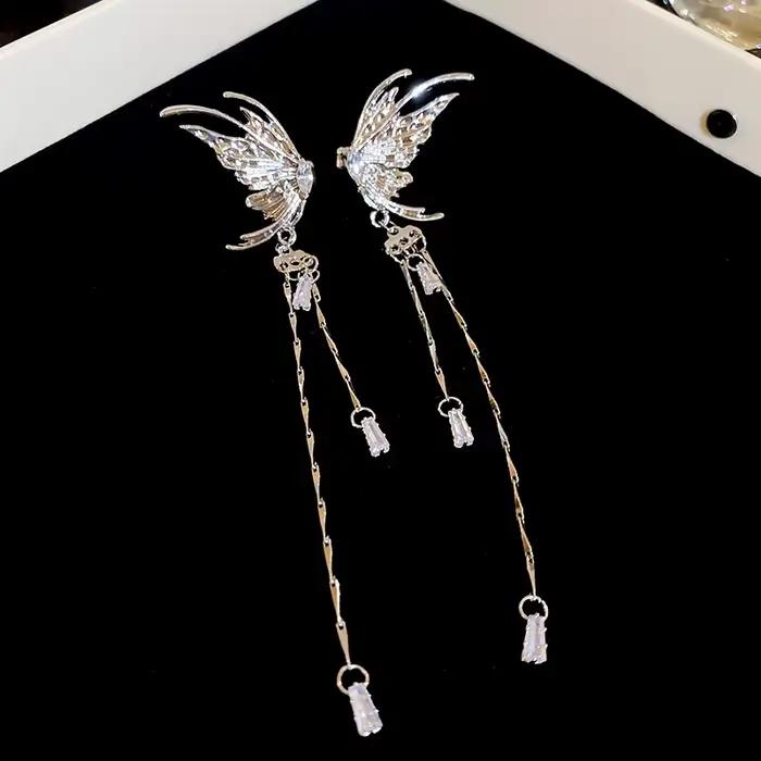 Boucles d'oreilles métalliques irrégulières en forme de C pour femmes, longue chaîne, pompon, os, Co