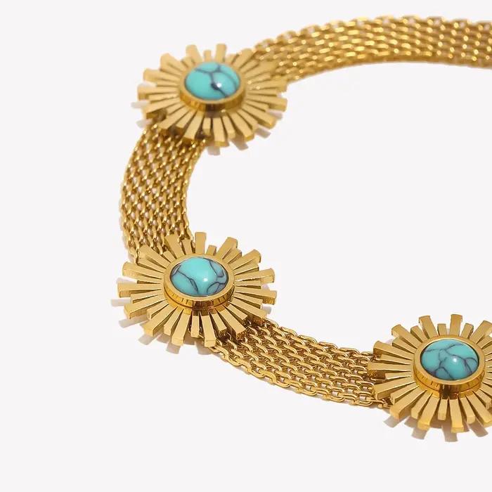 Bracelet en maille tissée bleu turquoise avec motif tournesol pour femmes occasions estivales et élégantes