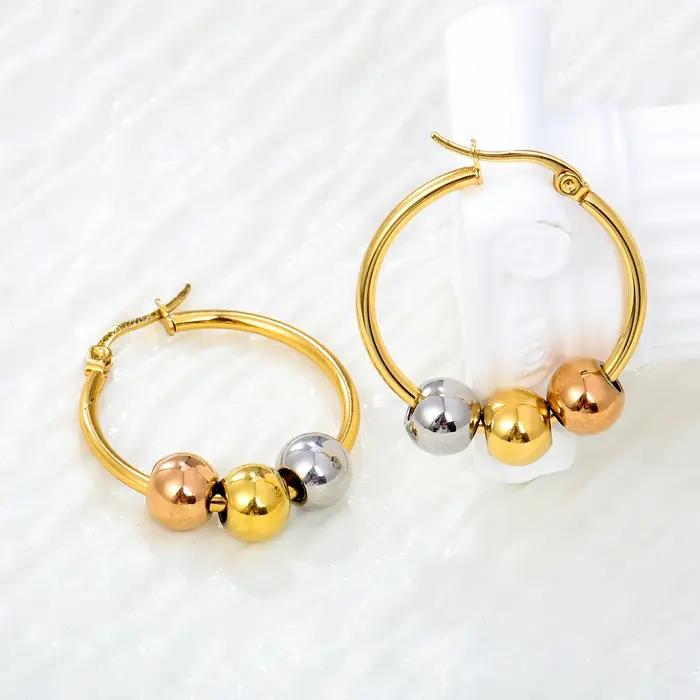 Boucles d'oreilles créoles Huggie à trois billes bicolores Or et Argent en Acier Inoxydable 316L