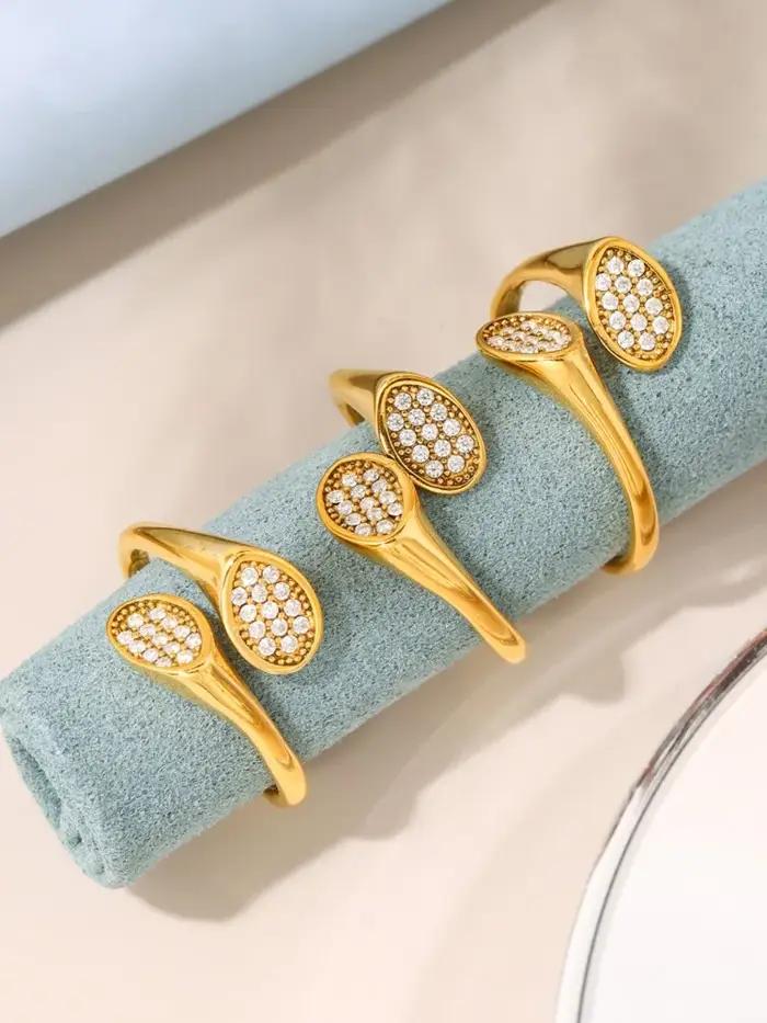 Bague en acier inoxydable plaquée or 18 carats sertie de zirconium brillant pour femmes style moderne et élégant pour soirée et occasions spéciales