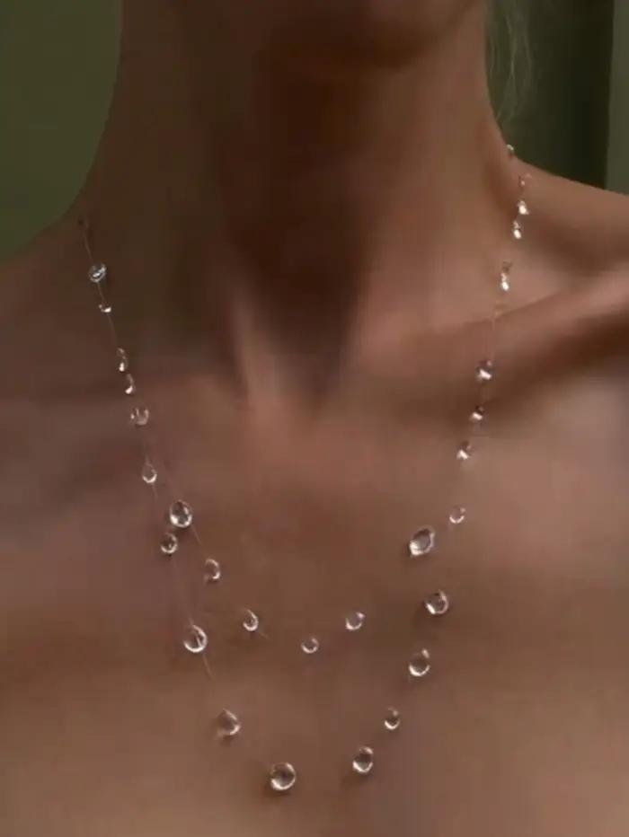 Collier série pompon en forme de goutte de rosée transparente