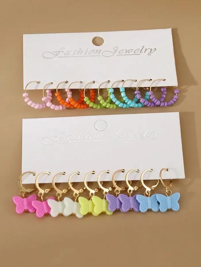 Ensemble de 20 paires de boucles d'oreilles pour filles : perles colorées et papillons. Le cadeau id