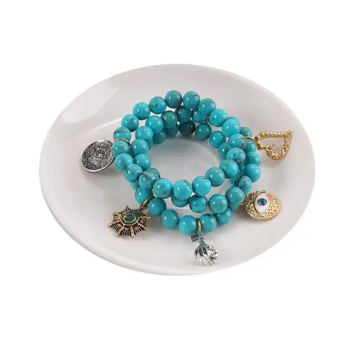 Bracelet bohème turquoise multi-breloques avec breloque œil porte-bonheur