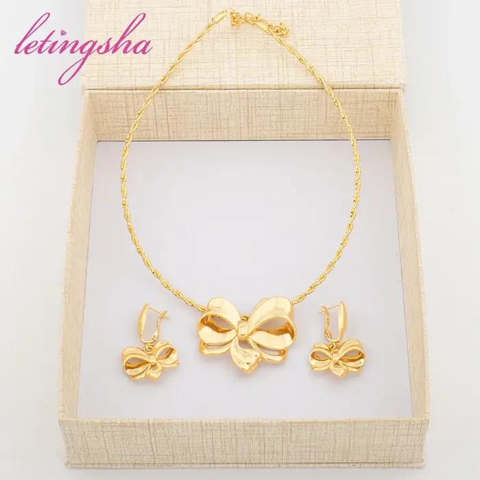 Ensemble de bijoux de luxe pour femmes design nœud papillon or jaune clair collier et boucles d'oreilles élégants pour occasions spéciales