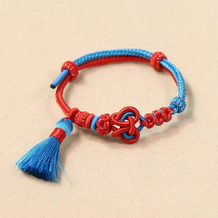 Bracelet tressé fait main style chinois 2026, nœud d'amour réglable avec pompon, motif fleur de pêch
