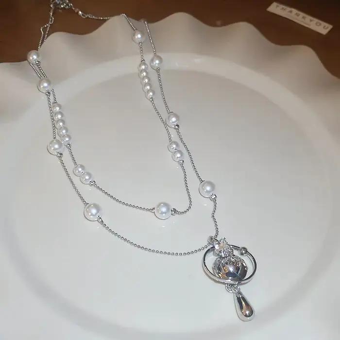 Collier de perles en forme de goutte d'eau saturne incrustée de diamants, chaîne de pull de luxe lég