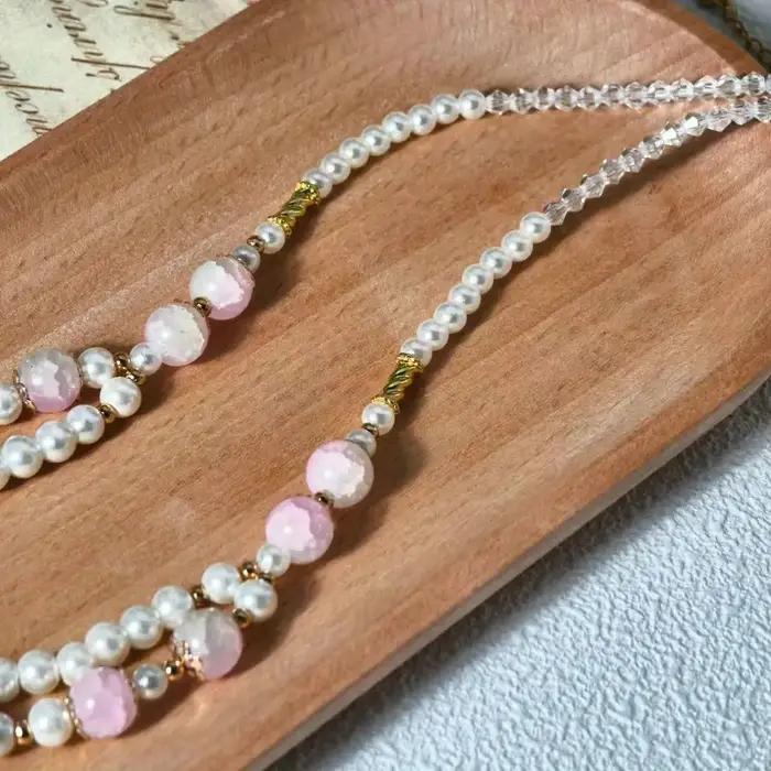 Collier à double rangée avec chaîne de perles en cristal rose