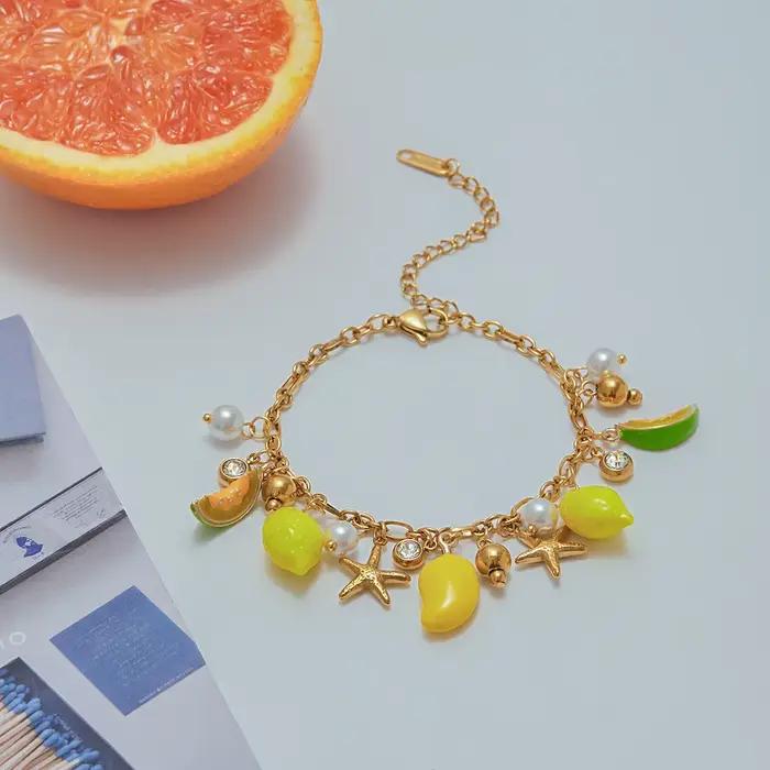 Bracelet à breloques en acier inoxydable avec motifs fruits exotiques et étoiles de mer pour femmes style moderne à offrir occasions spéciales