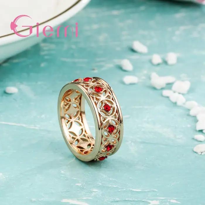 Bague centrale en cristal rouge incrusté creux pour femmes, couleur or Rose de haute qualité, bijoux à la mode, cadeau de fête d'anniversaire pour filles heureuses