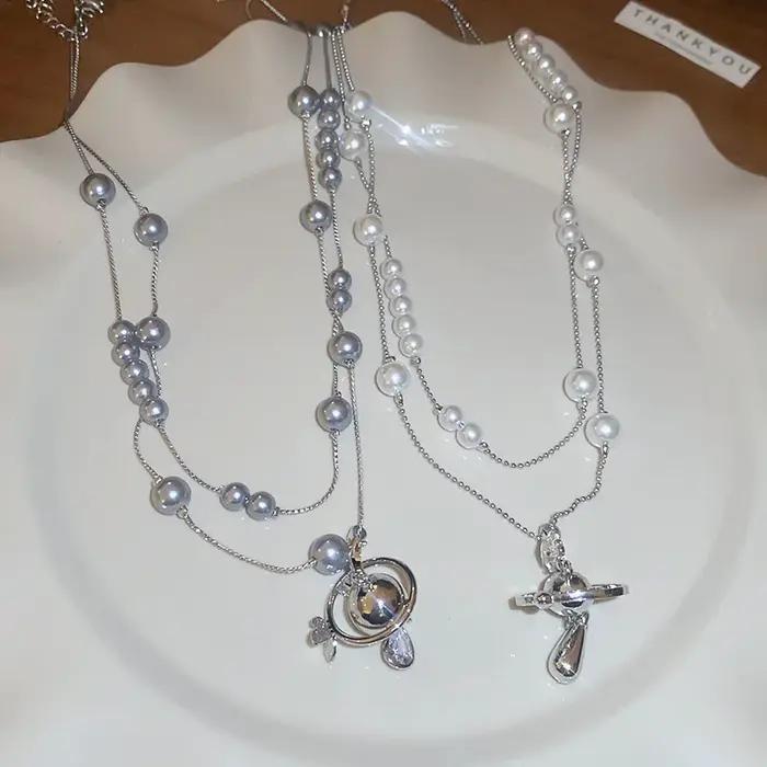 Collier de perles en forme de goutte d'eau saturne incrustée de diamants