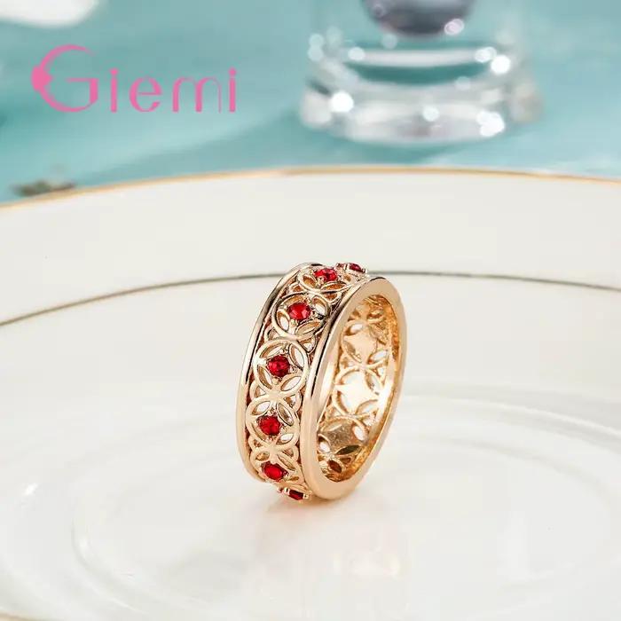 Bague centrale en cristal rouge incrusté creux pour femmes, couleur or Rose de haute qualité, bijoux à la mode, cadeau de fête d'anniversaire pour filles heureuses