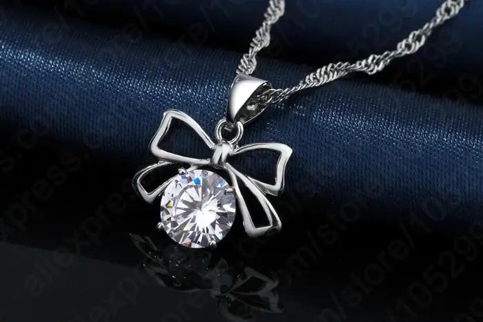 Ensemble de bijoux en strass brillant, comprend un pendentif avec nœud en argent 925, collier et bou
