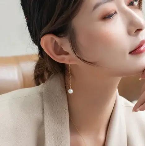 Boucles d'oreilles en or 18 carats avec perles blanches pour femmes modernes occasions spéciales elegance intemporelle
