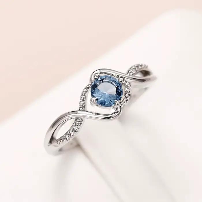 Alliance de mariage Huitan en laiton avec zircone cubique bleue, moderne et élégante pour mariage et anniversaire de mariage