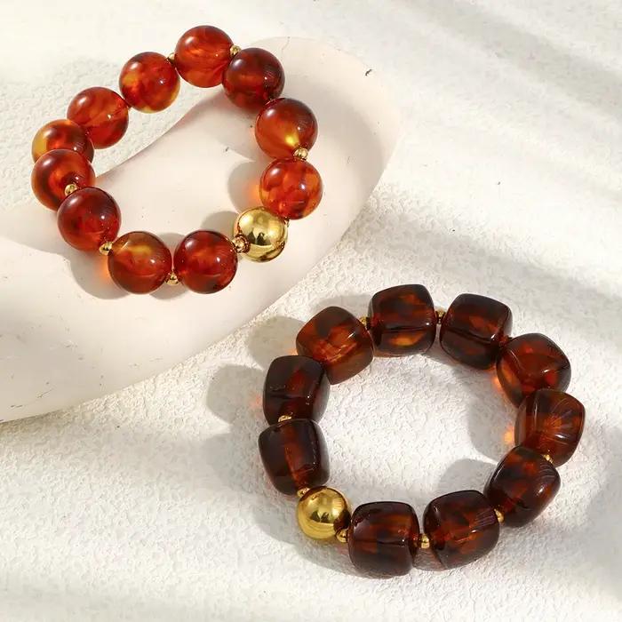 La. Bracelet de perles acryliques ambre série Muses Melad