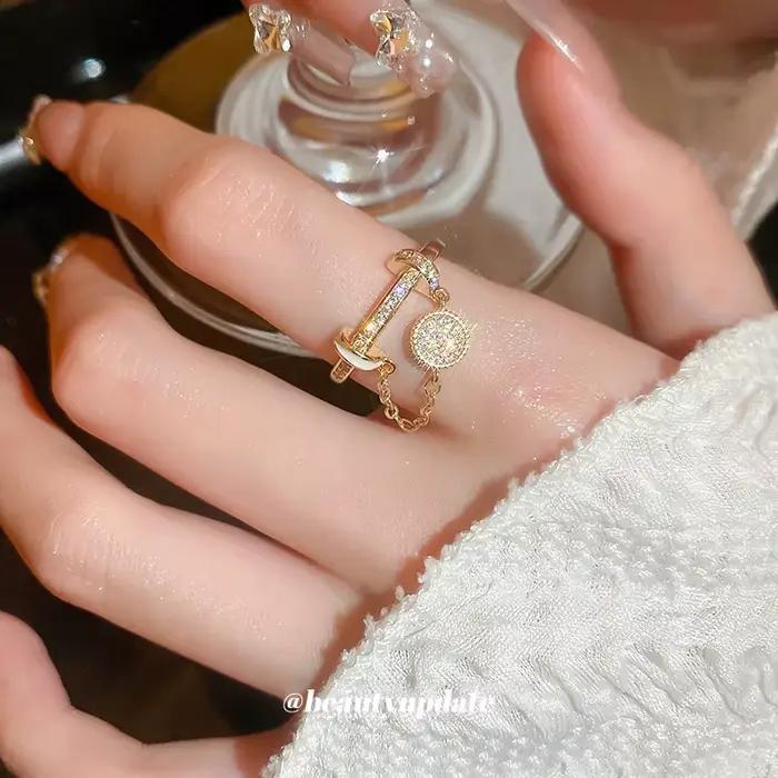 Bague en cuivre sertie de zirconium avec pampilles circulaires et détails goutte d'huile pour femmes élégantes et occasions spéciales