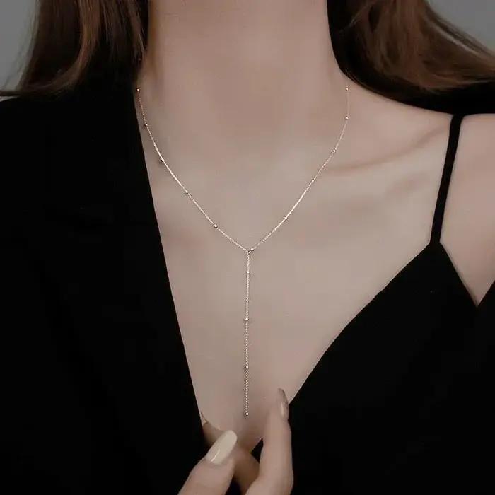 Collier à double couche avec pampilles géométriques pour femmes élégantes occasions spéciales style bohème romantique
