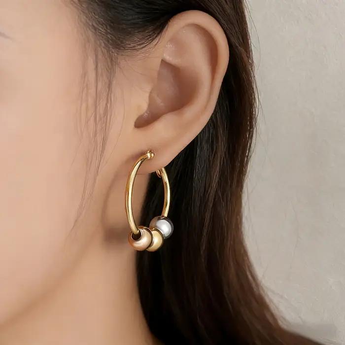 Boucles d'oreilles créoles Huggie à trois billes bicolores Or et Argent en Acier Inoxydable 316L
