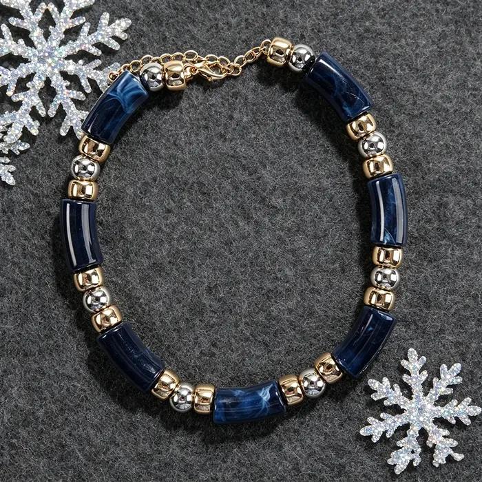 Collier statement en perles tubulaires effet marbre bleu marine avec entretoises dorées et argentées