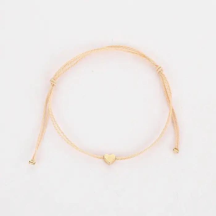 Bracelet en corde dorée avec pendentif cœur réglable pour femmes style bohème bijoux à la mode pour toutes les occasions