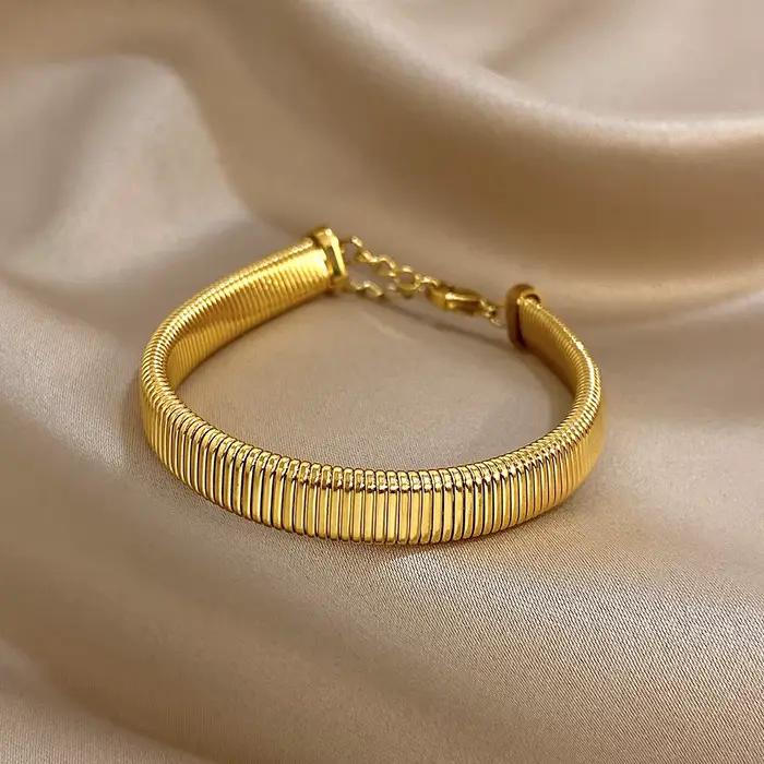 Bracelet de manchette en acier inoxydable plaqué or jaune clair avec zircon et strass