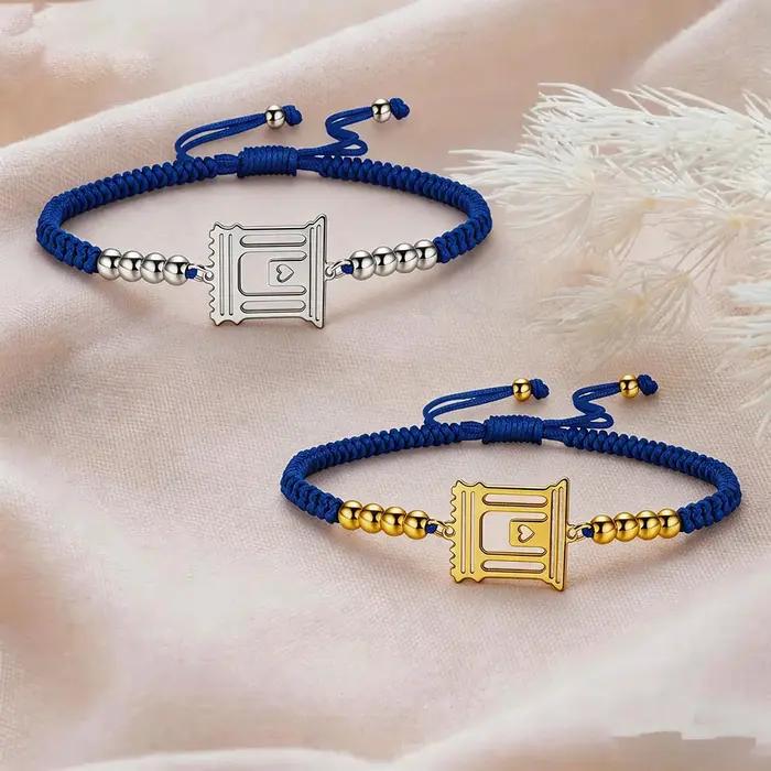 Bracelet ajustable en corde tressée avec pendentif charme du Temple Saint