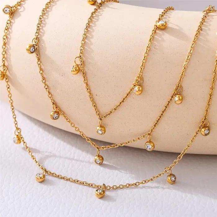 Chaîne de cheville pour femme en acier inoxydable avec breloques multi-zirconiums