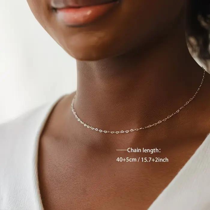 Collier en acier inoxydable forme de cœur évidé zirconium blanc élégant pour femmes occasions spéciales romantiques Saint-Valentin