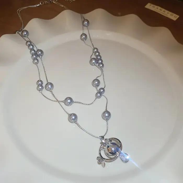 Collier de perles en forme de goutte d'eau saturne incrustée de diamants